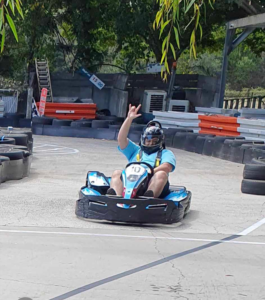Speeding down the straight in the go-kart